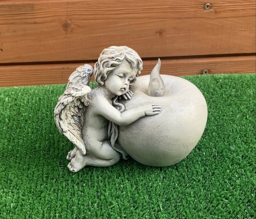 Stone effect angel resting - effect, on